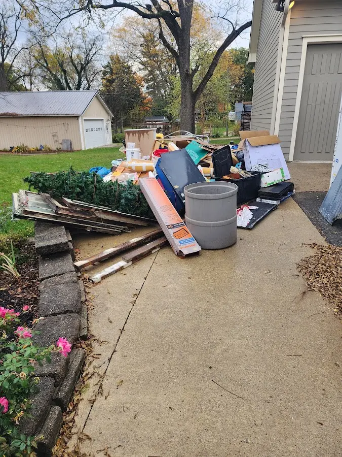 Dumpster being loaded with debris for Demolition Dumpster Rental in Powdersville